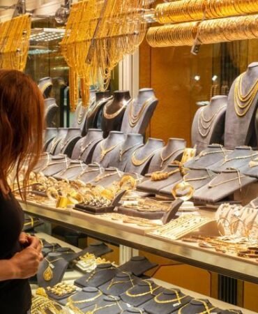 woman looking at jewelery showcase